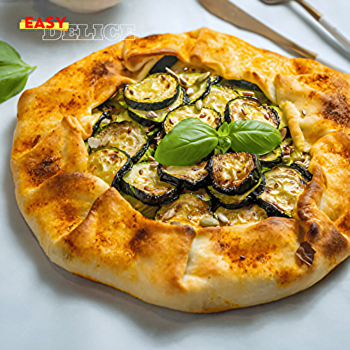 Cette tarte rustique courgettes et parmesan est une recette simple et savoureuse qui met en valeur la douceur des courgettes, associée au goût salé et intense du parmesan.